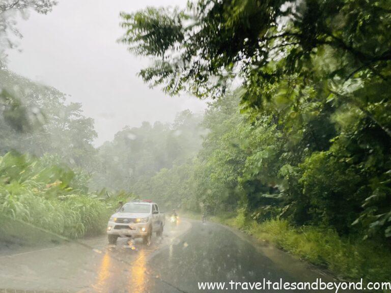 Rainy jungle road driving south toward Uvita beach along the Costa Rica Pacific coast
