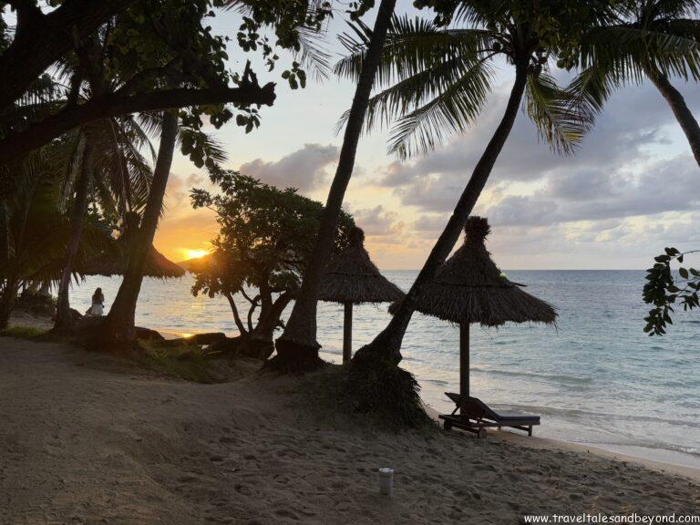 Sunset over white sand beach in Fiji