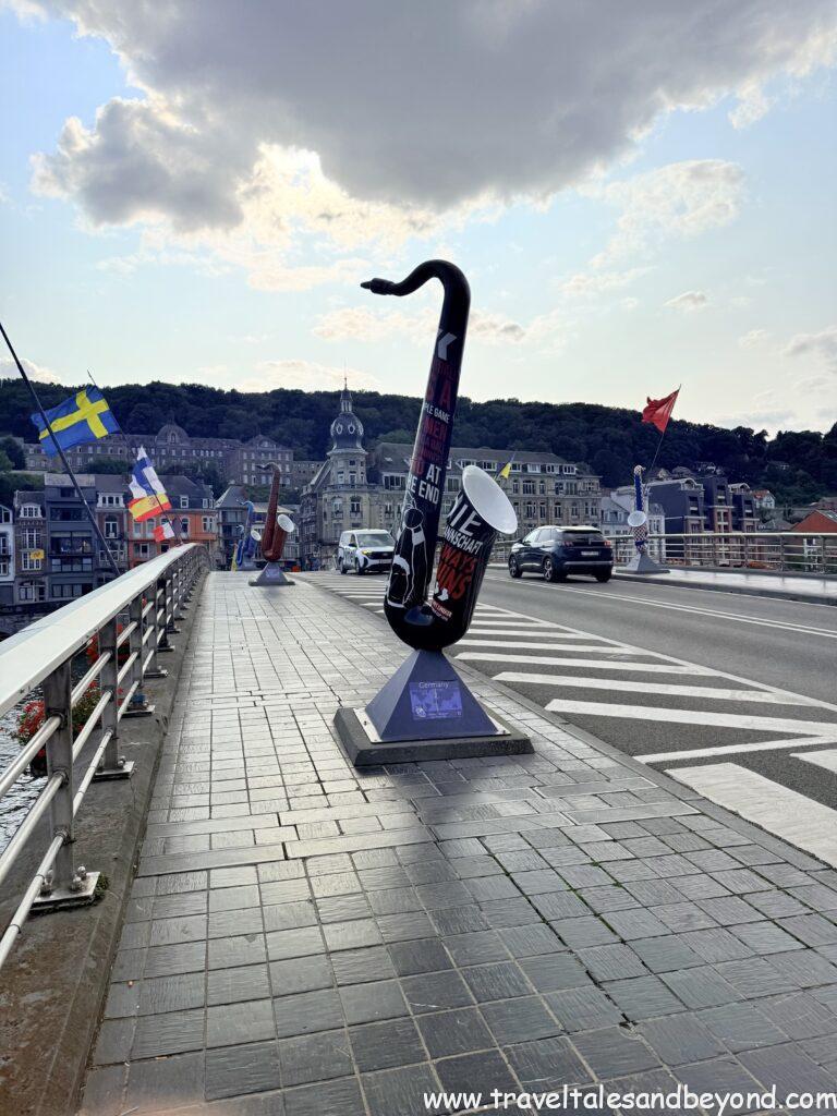 Colorful saxophone sculptures along the riverfront of Dinant, birthplace of saxophone inventor Adolphe Sax, Belgium