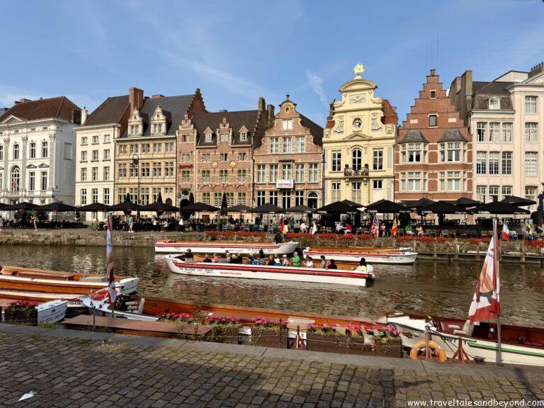 Medieval guild houses and canal reflections along the Graslei waterfront in Ghent, Belgium
