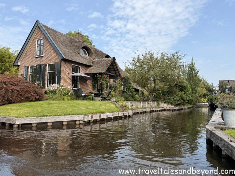 Cars stay at the edge — from here, you explore Giethoorn on foot or by boat