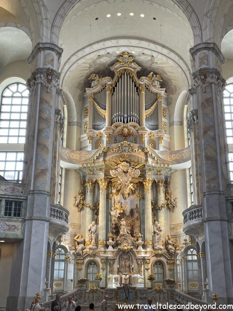 Baroque interior of Dresden Frauenkirche showing ornate gilded altar, pipe organ, and marble columns after post-WWII reconstruction, Dresden, Saxony, Germany