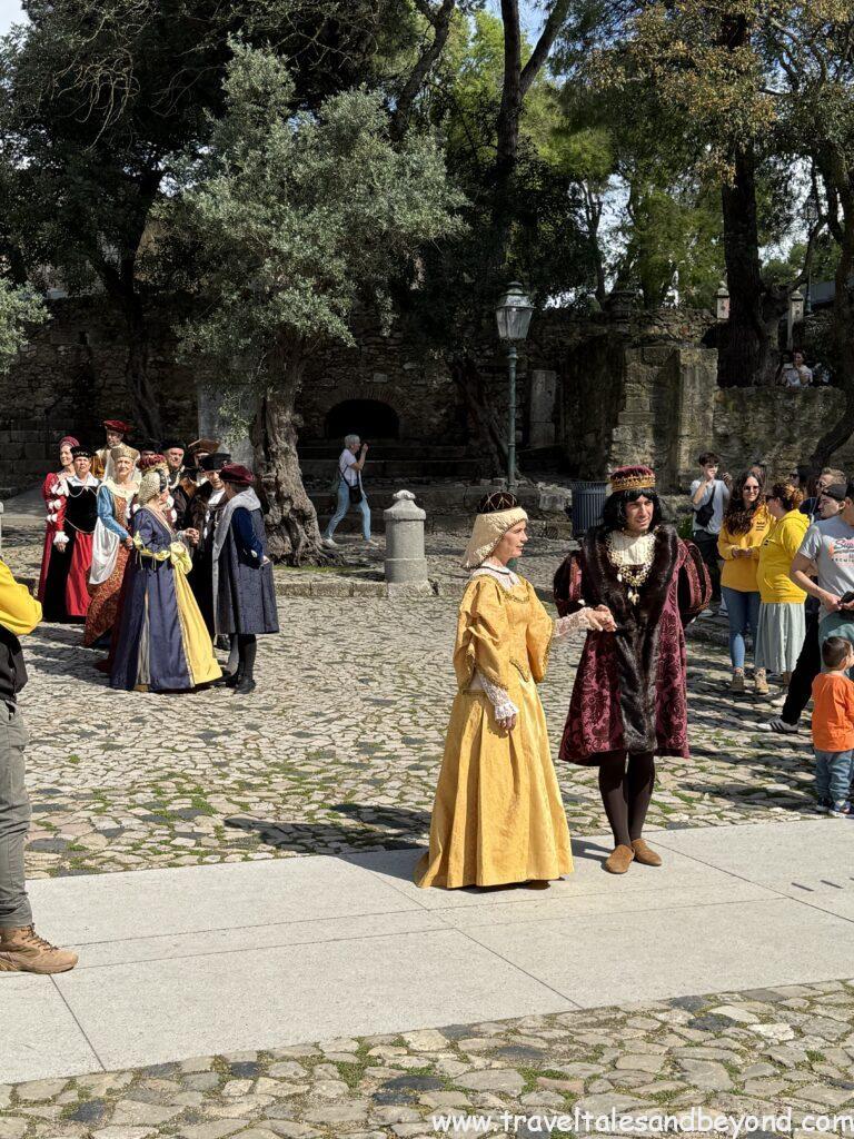 Historical reenactment and court dance performance at São Jorge Castle, Lisbon, showcasing Portuguese royal life from the 15th century.