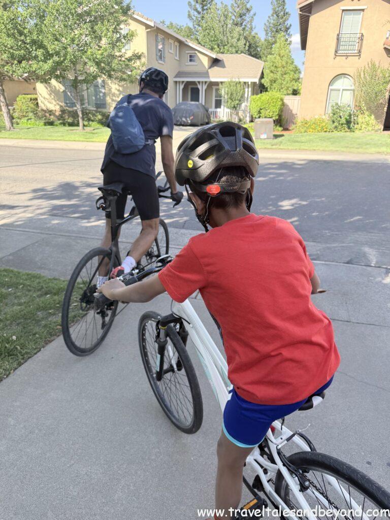 A 10-year-old boy cycling on a road in California during a training ride with his uncle ahead of the STP