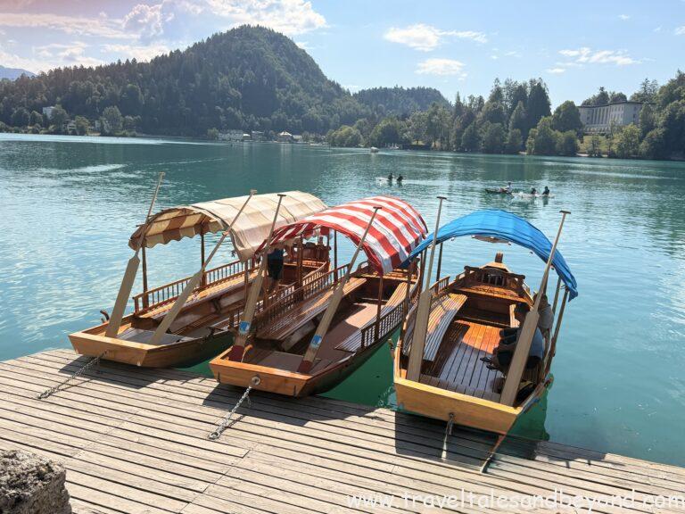 Pletna boat crossing turquoise Lake Bled toward the island church