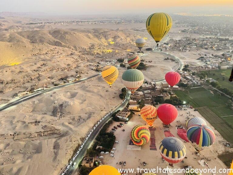 Hot air balloons rising over Luxor's West Bank at sunrise